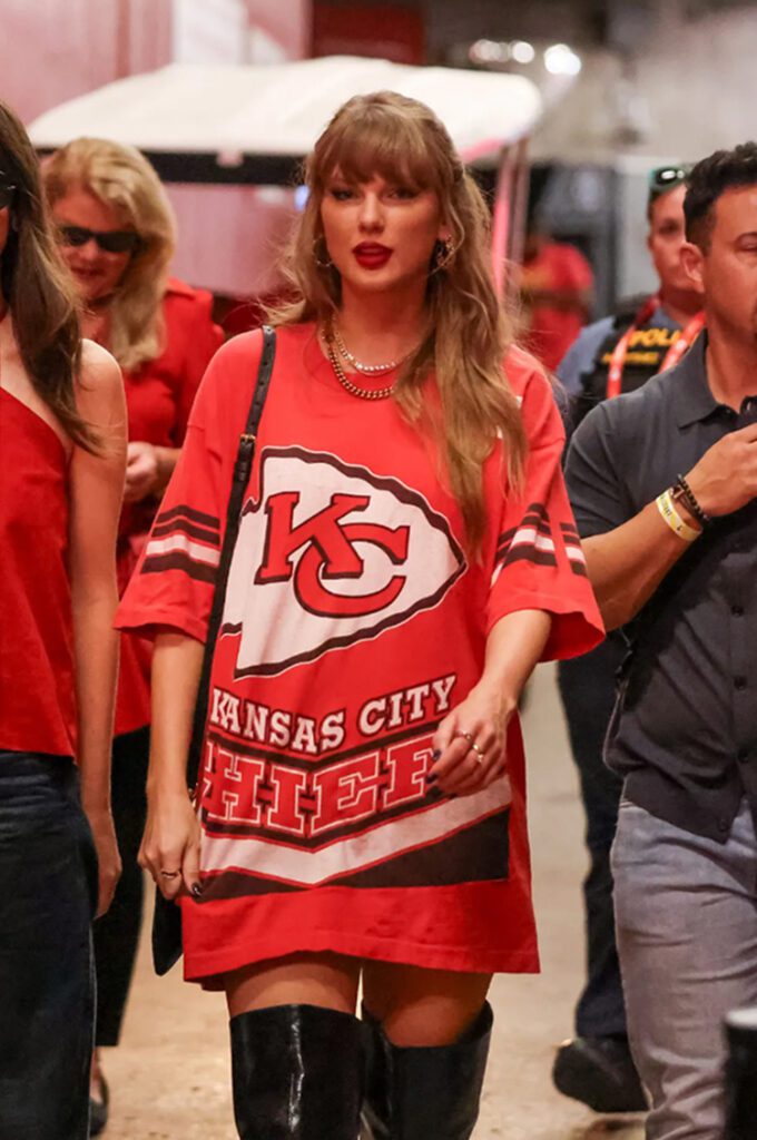 Taylor Swift at a football game between the "Cincinnati Bengals and Kansas City Chiefs" on Sept. 15 in Kansas City, Missouri, vintage t-shirt dress, Giuseppe Zanotti  long-boots